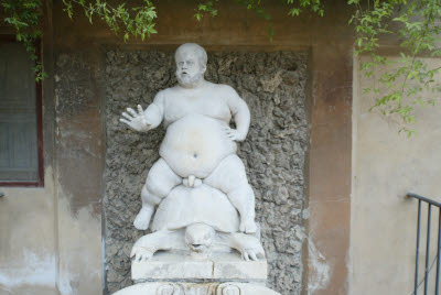 Naked Fat Guy Sitting on a Turtle