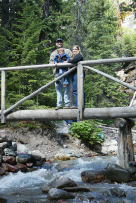 Adam, Jodi and Emma at a creek in Glacier
