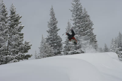 Snowboarder does flip