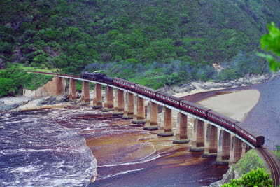 Steam train crosses bridge in South Africa