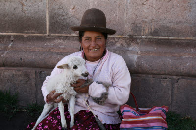 Peruvian woman with goat, Cuzco, Peru