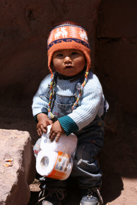 Baby playing w/ Toilet Paper,Tequile Island, Lake Titicaca, Peru