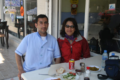 Amynah with waiter at lunch in Soke, Turkey